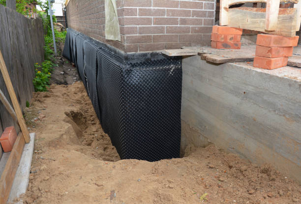 SJ Waterproofing Pros technician performing targeted Basement Waterproofing assessment in Norwich, OH